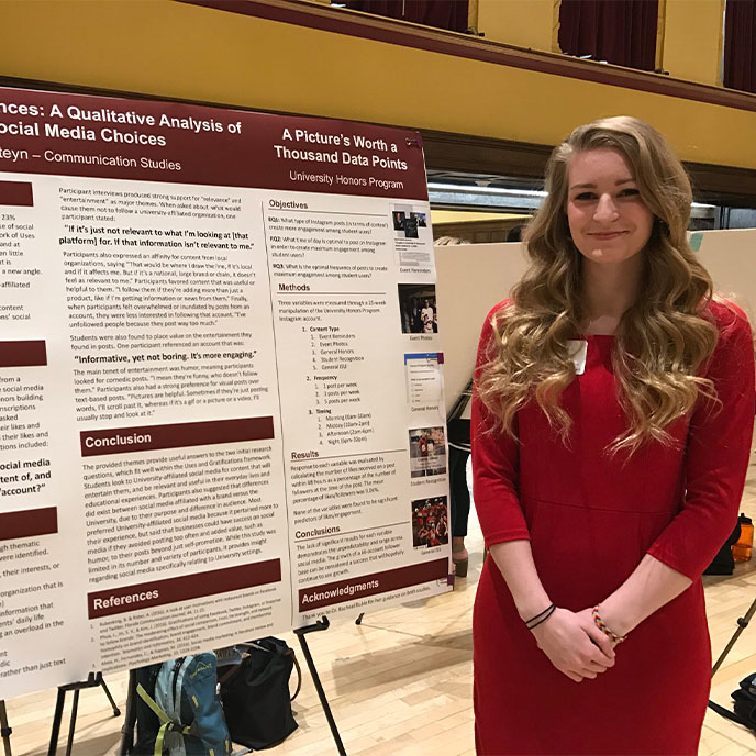 Caroline Arkesteyn presenting her research at the honors poster session.